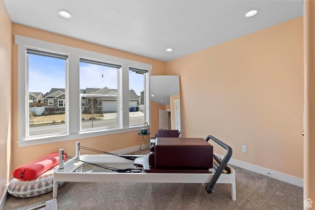 workout room featuring carpet floors, baseboards, and recessed lighting