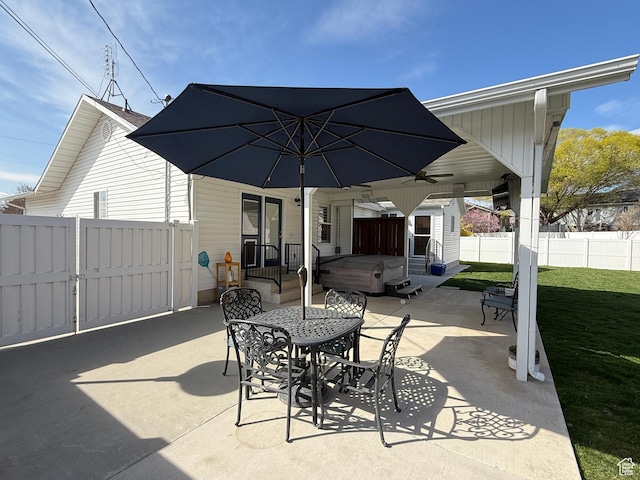 view of patio with entry steps, a ceiling fan, fence, and a gate
