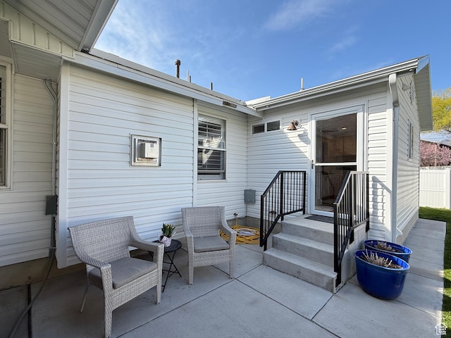 back of property with a patio