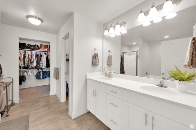 3632 E Sapphire Creek Ln N Unit 318, Eagle Mountain, UT 84005 - full bath featuring wood finished floors, a sink, a shower stall, and double vanity