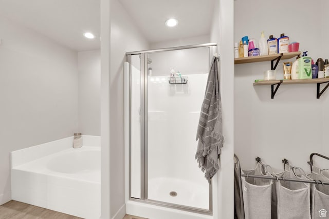 3632 E Sapphire Creek Ln N Unit 318, Eagle Mountain, UT 84005 - full bath with recessed lighting, a bath, wood finished floors, and a stall shower