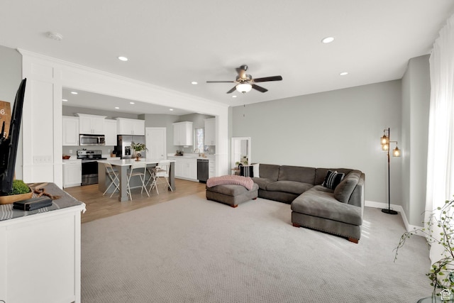 3632 E Sapphire Creek Ln N Unit 318, Eagle Mountain, UT 84005 - living room featuring light colored carpet, ceiling fan, baseboards, and recessed lighting