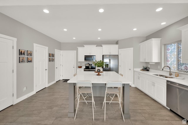 3632 E Sapphire Creek Ln N Unit 318, Eagle Mountain, UT 84005 - kitchen featuring white cabinets, wood tiled floor, stainless steel appliances, and a sink