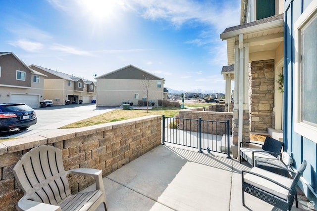 3632 E Sapphire Creek Ln N Unit 318, Eagle Mountain, UT 84005 - view of patio / terrace featuring a porch and a residential view