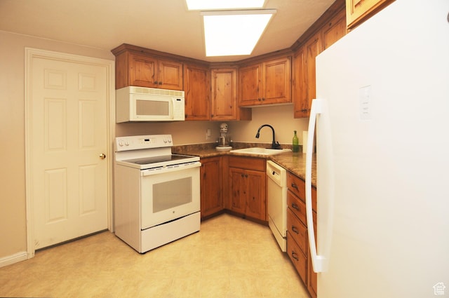 360 E 1825 N, Centerville, UT 84014 - kitchen with brown cabinetry, a sink, white appliances, and light floors