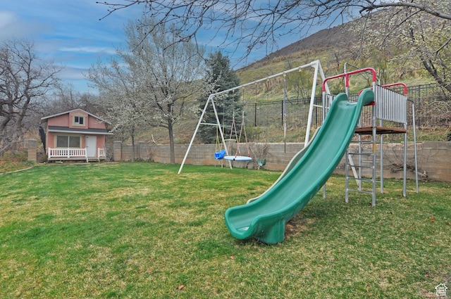 360 E 1825 N, Centerville, UT 84014 - view of play area featuring a yard, fence, and an outbuilding