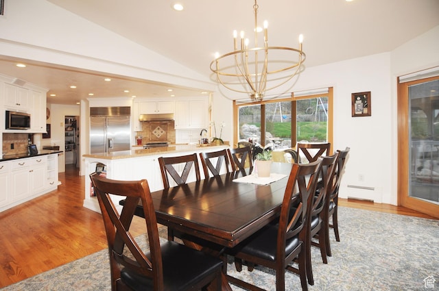 360 E 1825 N, Centerville, UT 84014 - dining space featuring an inviting chandelier, light wood-style flooring, recessed lighting, lofted ceiling, and a baseboard radiator