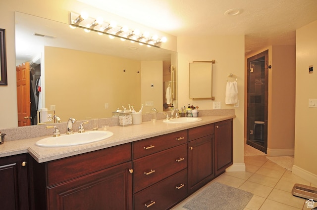 360 E 1825 N, Centerville, UT 84014 - bathroom featuring tile patterned flooring, visible vents, a sink, and a stall shower