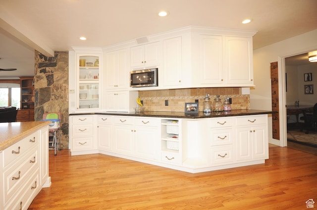 360 E 1825 N, Centerville, UT 84014 - kitchen with stainless steel microwave, recessed lighting, light wood-style flooring, white cabinetry, and backsplash