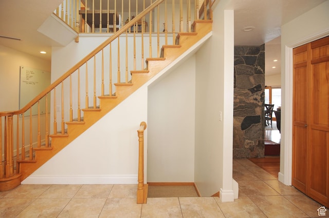 360 E 1825 N, Centerville, UT 84014 - stairway featuring baseboards, recessed lighting, tile patterned flooring, and a high ceiling