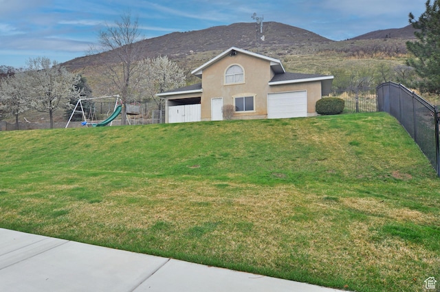360 E 1825 N, Centerville, UT 84014 - exterior space featuring fence, a mountain view, a playground, and a garage