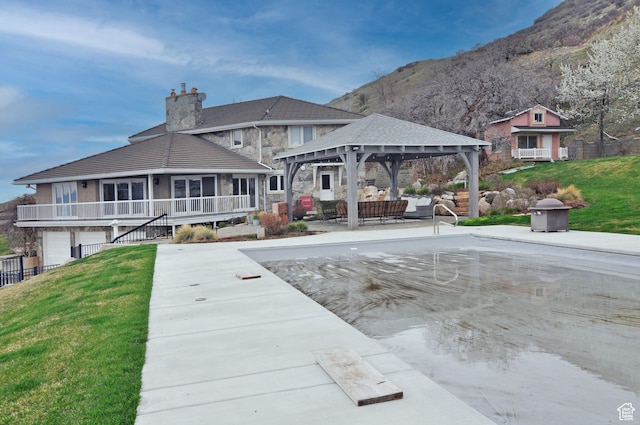 360 E 1825 N, Centerville, UT 84014 - rear view of property featuring a gazebo, stone siding, a chimney, and a lawn