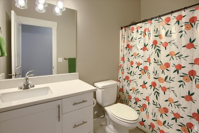 bathroom featuring toilet, curtained shower, and vanity