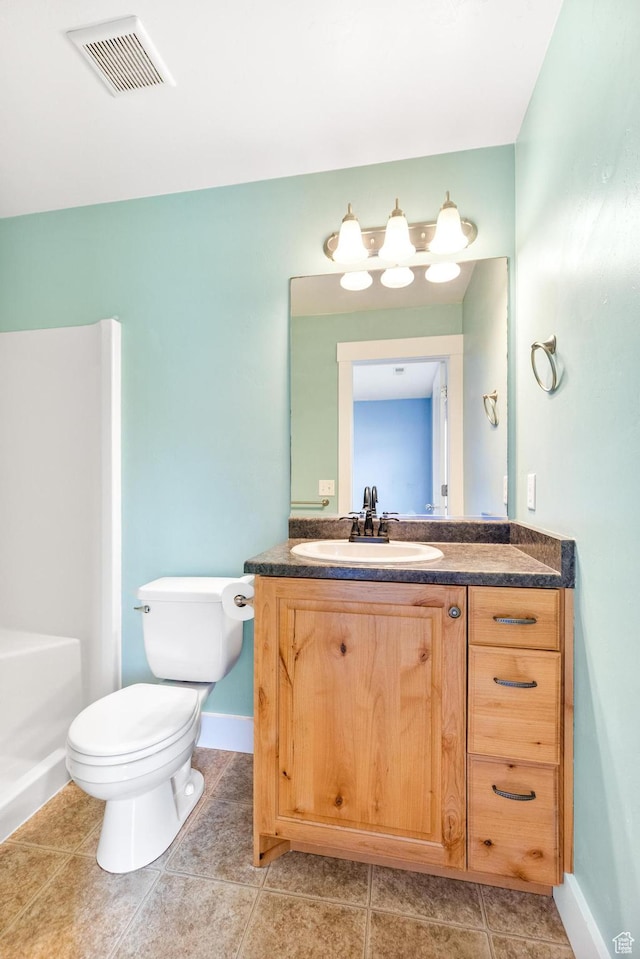 bathroom with vanity, baseboards, tile patterned floors, toilet, and visible vents