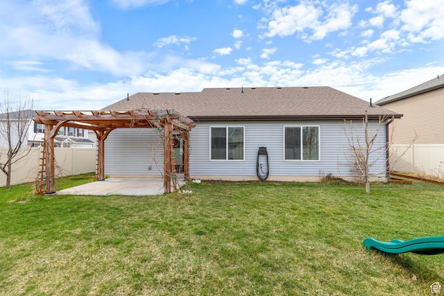 back of property with a patio, a yard, a pergola, and a fenced backyard