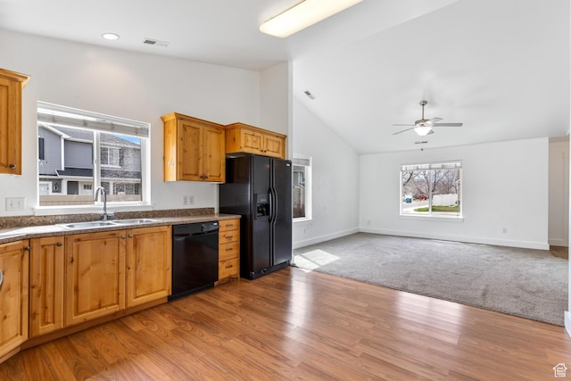 kitchen featuring a ceiling fan, visible vents, black appliances, a sink, and dark countertops