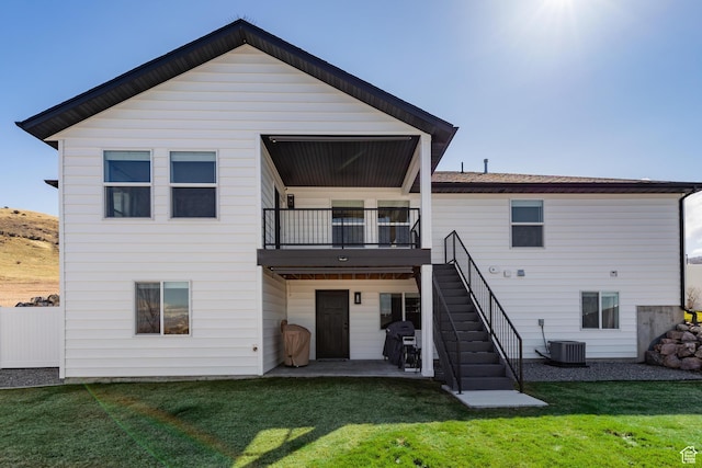 51 S 1250 E, Smithfield, UT 84335 - rear view of house featuring central AC unit, a lawn, fence, stairway, and a patio