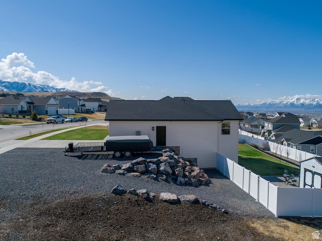 51 S 1250 E, Smithfield, UT 84335 - view of side of home featuring a mountain view, a fenced backyard, and a residential view