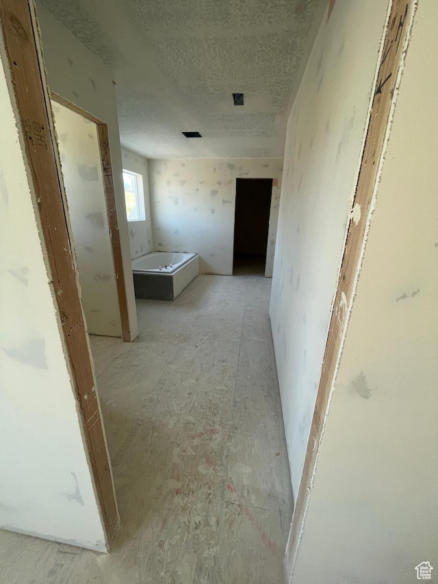 7007 W Hazel Oak Ct Unit 212, Herriman, UT 84096 - hall featuring a textured ceiling
