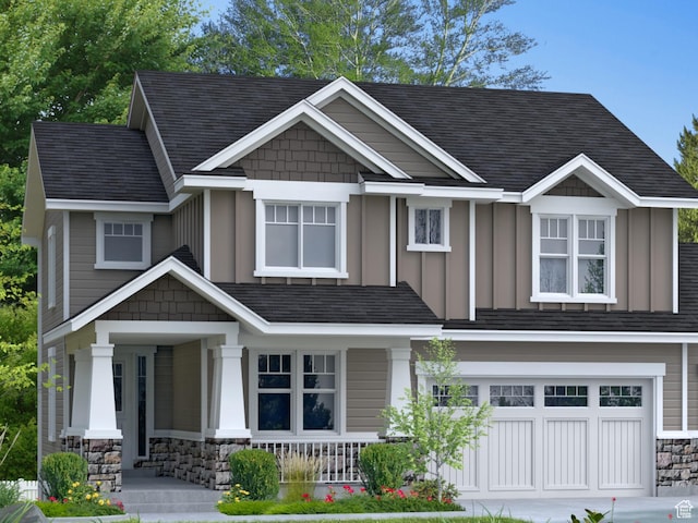 view of front of house featuring a shingled roof, an attached garage, stone siding, covered porch, and board and batten siding