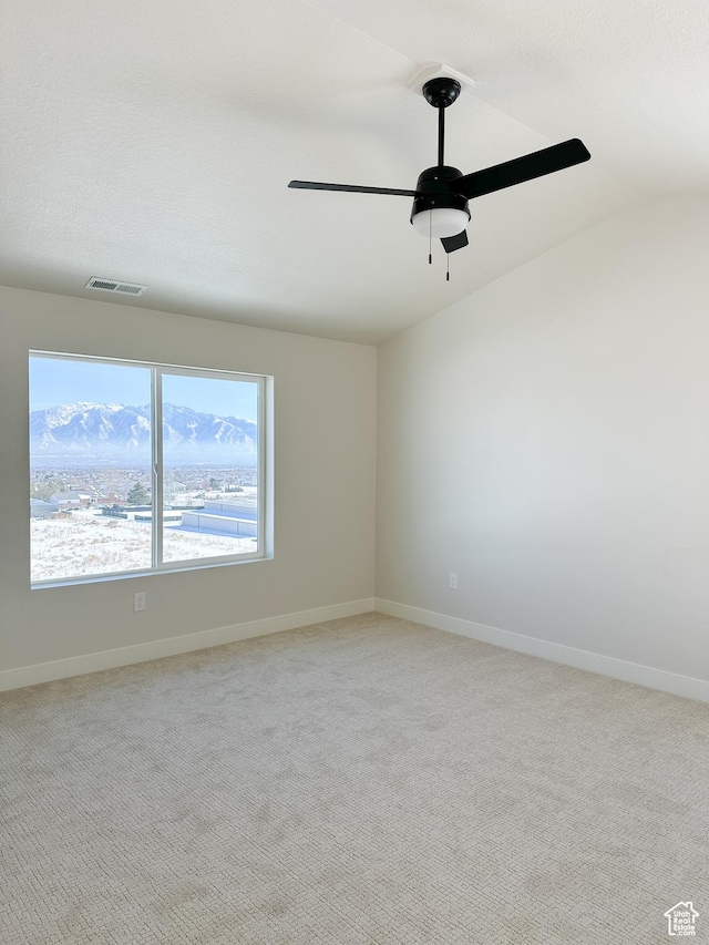 7007 W Hazel Oak Ct Unit 212, Herriman, UT 84096 - spare room featuring lofted ceiling, a ceiling fan, and light colored carpet