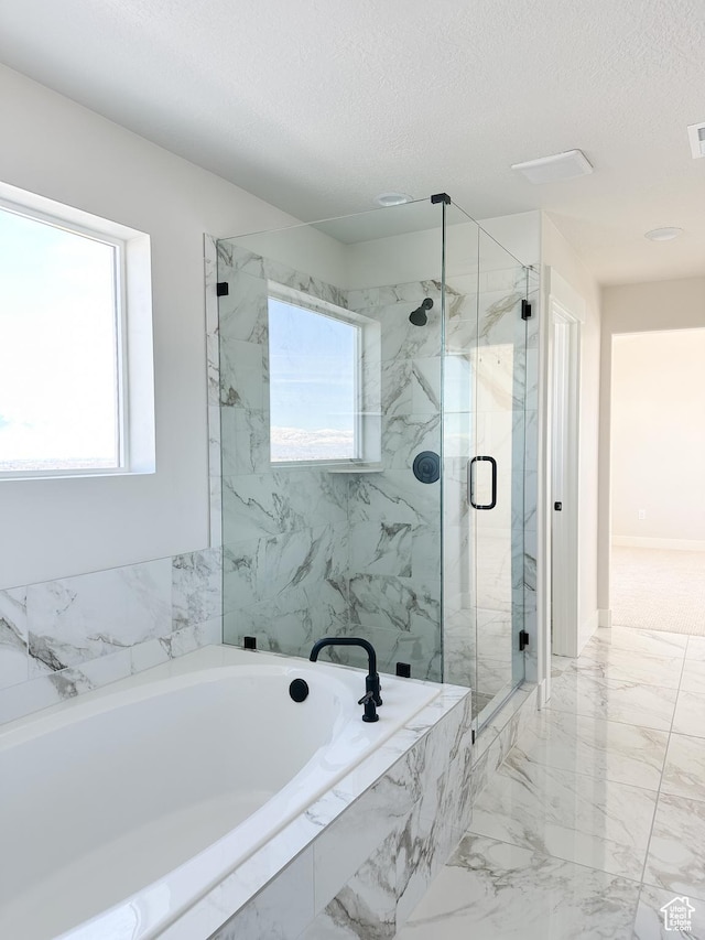 7007 W Hazel Oak Ct Unit 212, Herriman, UT 84096 - full bathroom with a garden tub, marble finish floors, a marble finish shower, and a textured ceiling