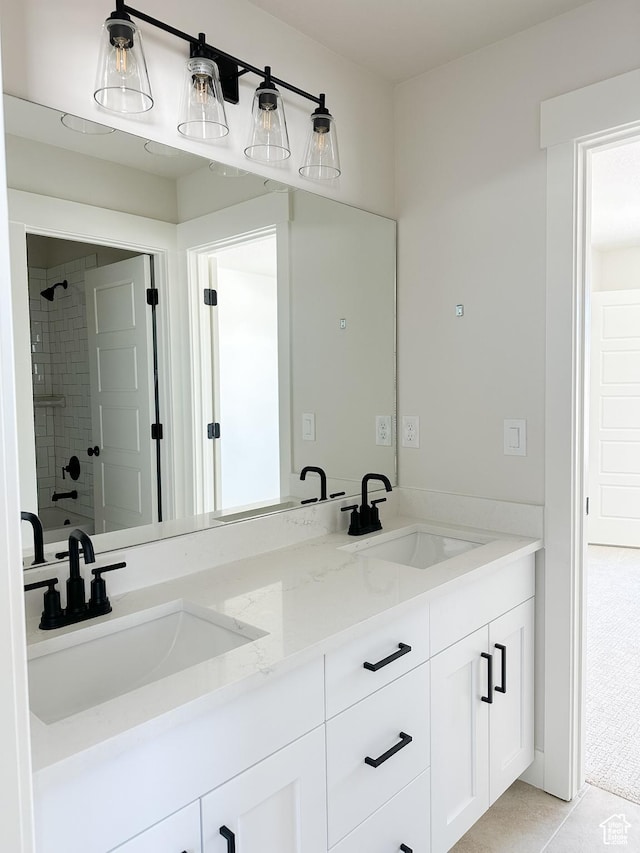 7007 W Hazel Oak Ct Unit 212, Herriman, UT 84096 - full bathroom featuring double vanity, a tile shower, and tile patterned flooring