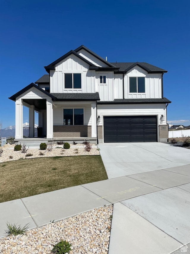 7007 W Hazel Oak Ct Unit 212, Herriman, UT 84096 - modern farmhouse featuring board and batten siding, a garage, concrete driveway, and a front lawn
