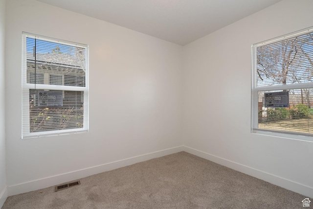 924 W California Ave, Salt Lake City, UT 84104 - empty room featuring plenty of natural light, visible vents, and carpet floors