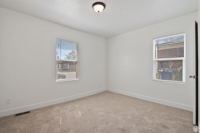 924 W California Ave, Salt Lake City, UT 84104 - carpeted empty room with visible vents and baseboards