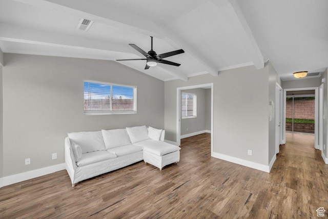unfurnished living room with lofted ceiling with beams, wood finished floors, baseboards, and visible vents
