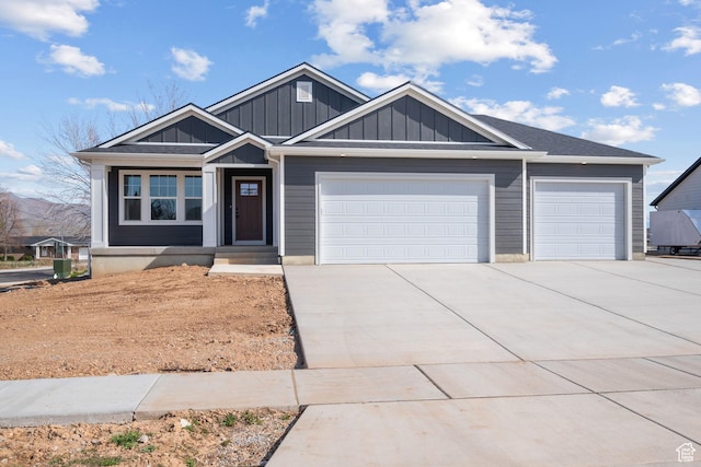 view of front of home featuring an attached garage, board and batten siding, and driveway