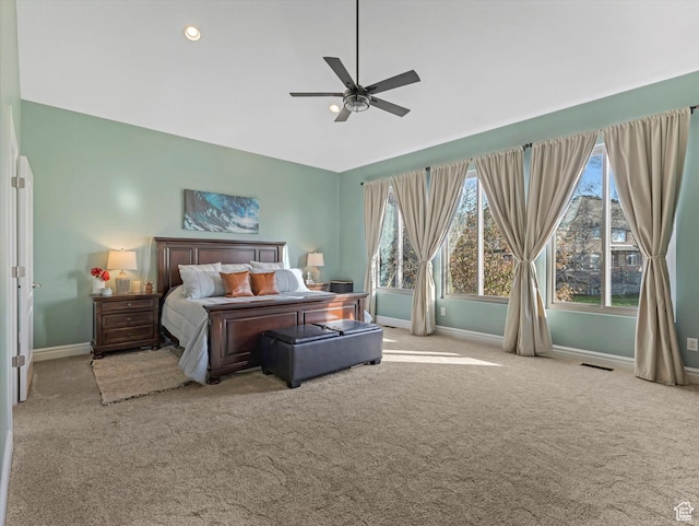 bedroom featuring baseboards, multiple windows, carpet floors, and visible vents