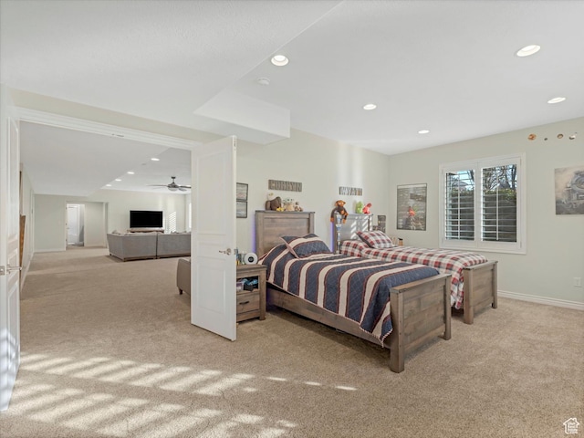 carpeted bedroom featuring baseboards and recessed lighting