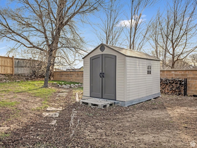 view of shed featuring a fenced backyard