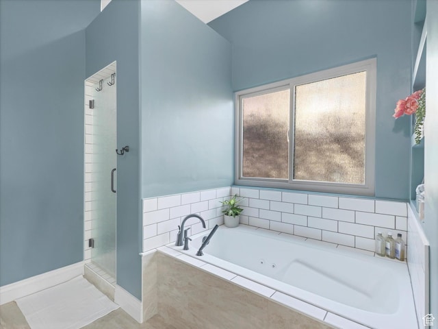 bathroom featuring tile patterned flooring, a shower stall, and a bath