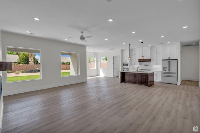 39 W Elinor Ln, Washington, UT 84780 - kitchen featuring open floor plan, light countertops, white cabinets, ceiling fan, and stainless steel appliances