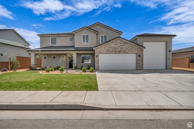 traditional home with an attached garage, driveway, stucco siding, and a front yard