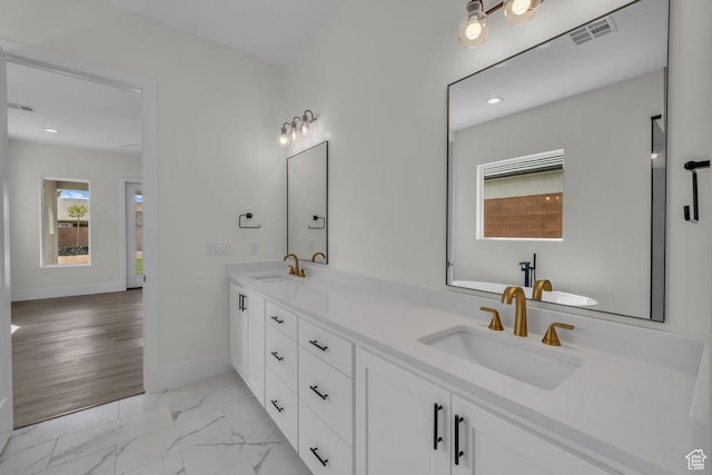 39 W Elinor Ln, Washington, UT 84780 - bathroom featuring baseboards, marble finish floor, a sink, and visible vents