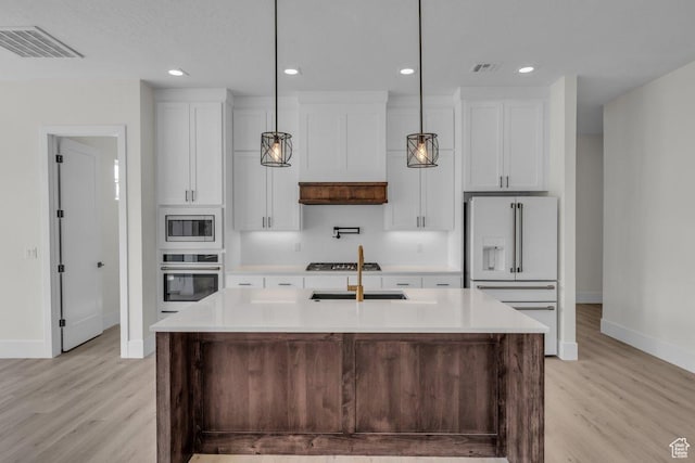 39 W Elinor Ln, Washington, UT 84780 - kitchen featuring white cabinets, light countertops, visible vents, and stainless steel appliances