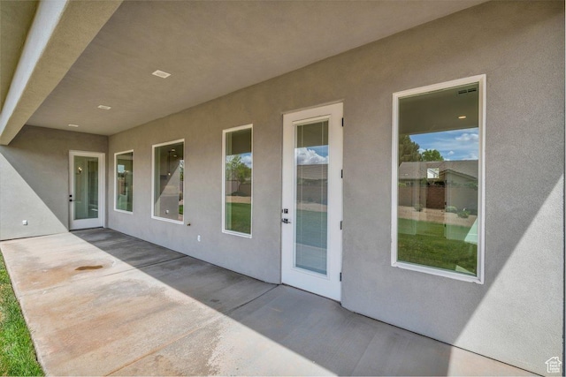 39 W Elinor Ln, Washington, UT 84780 - doorway to property with a patio area and stucco siding