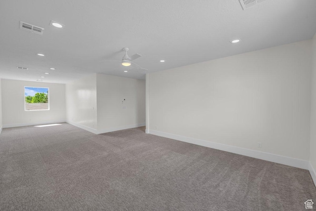39 W Elinor Ln, Washington, UT 84780 - spare room featuring carpet flooring, visible vents, baseboards, and a ceiling fan