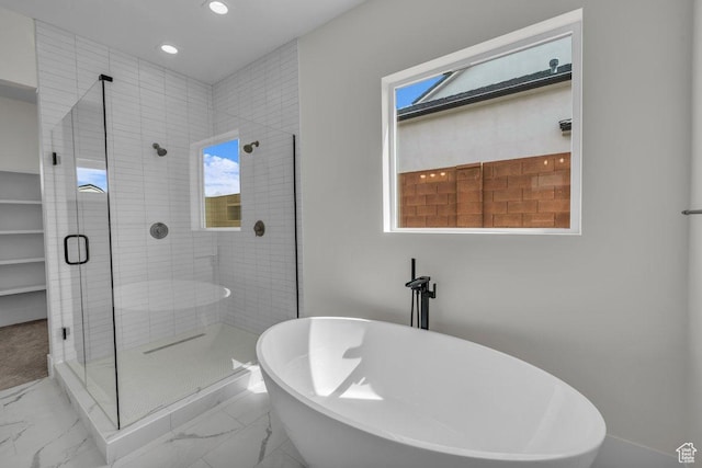 39 W Elinor Ln, Washington, UT 84780 - full bath featuring a shower stall, marble finish floor, a freestanding tub, and recessed lighting