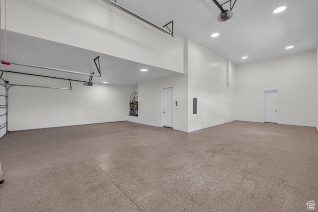 39 W Elinor Ln, Washington, UT 84780 - garage with a garage door opener, baseboards, and recessed lighting