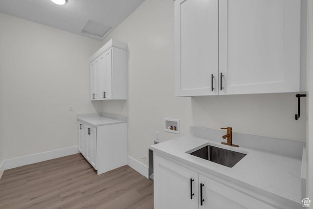 39 W Elinor Ln, Washington, UT 84780 - laundry room featuring baseboards, a sink, cabinet space, light wood-style flooring, and hookup for a washing machine