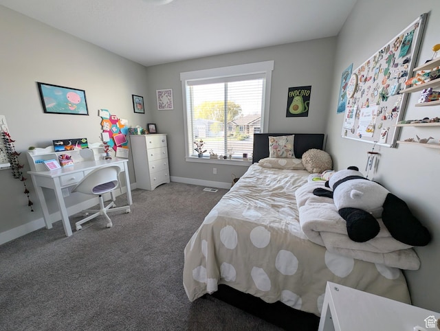 bedroom with baseboards and carpet floors