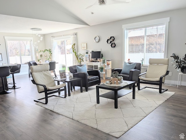 living room with lofted ceiling, wood finished floors, and ceiling fan