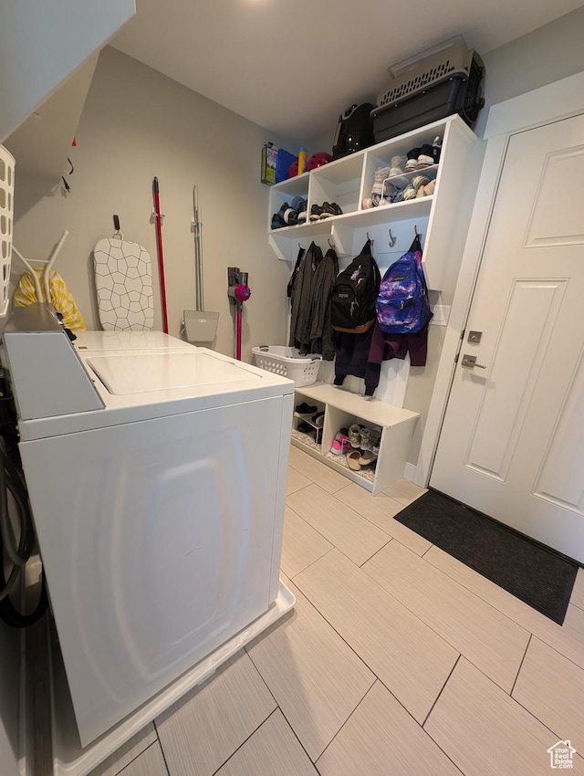 clothes washing area featuring washer and dryer and laundry area