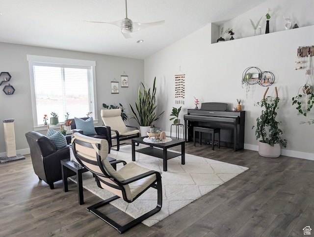 living area featuring wood finished floors, a ceiling fan, and baseboards