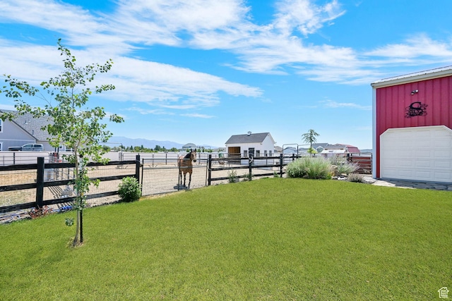 2282 N 3430 W, Clinton, UT 84015 - view of yard with an outdoor structure, a mountain view, and a garage